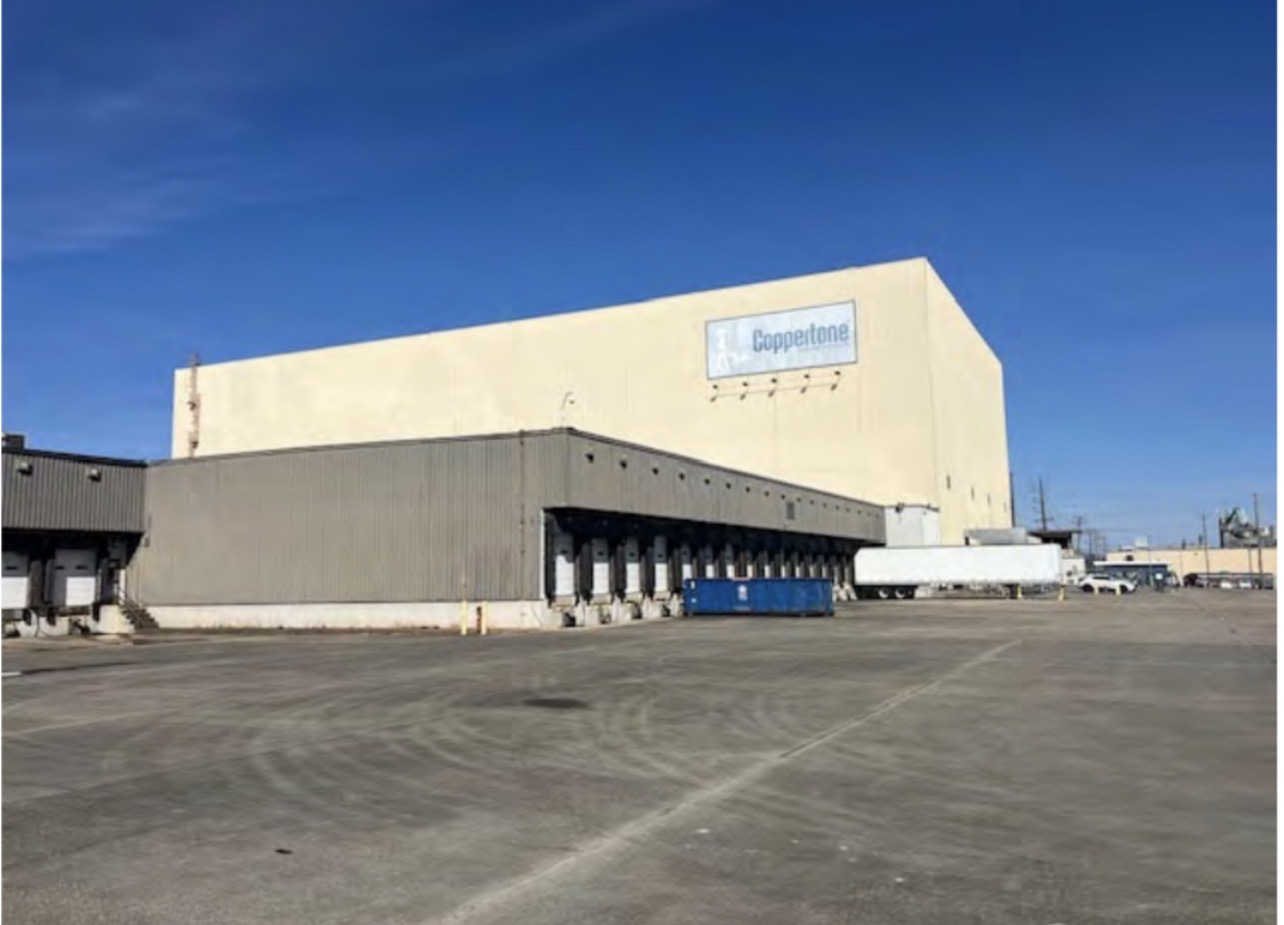 High-bay manufacturing building exterior with dock line